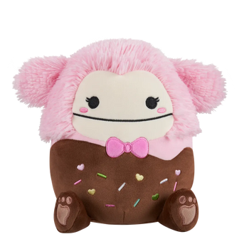 Squishmallows Brina la Pie Grande Bañada en Chocolate con Pajarita Rosa, 20 cm